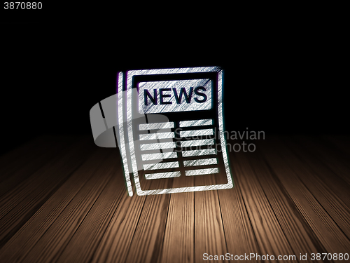 Image of News concept: Newspaper in grunge dark room