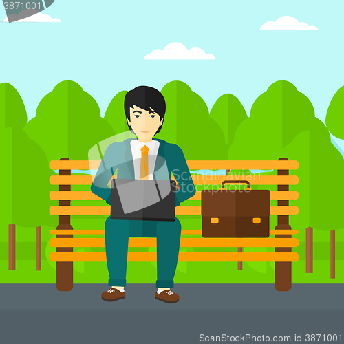 Image of Man working on laptop.