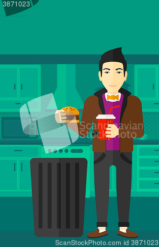 Image of Man throwing junk food.