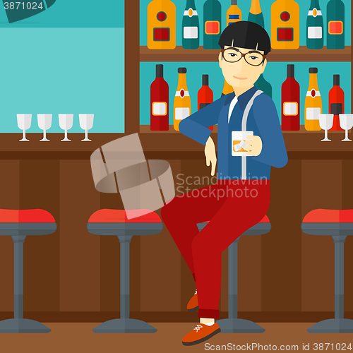 Image of Man sitting at bar.