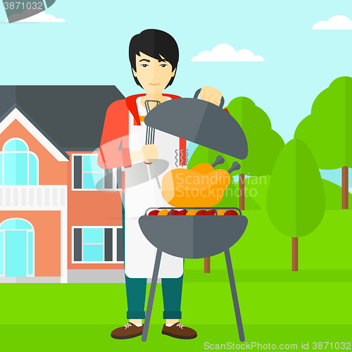 Image of Man preparing barbecue.