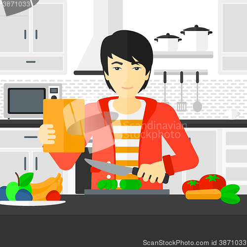 Image of Man cooking meal.