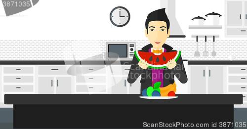 Image of Man eating watermelon.