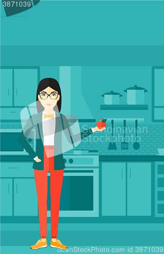 Image of Woman holding apple.