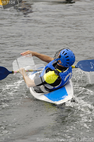 Image of Man playing kayak polo