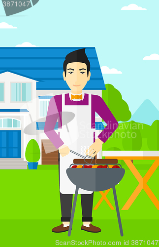 Image of Man preparing barbecue.