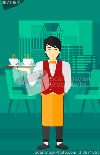 Image of Waiter holding tray with beverages.