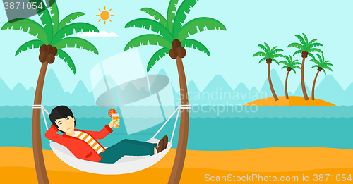 Image of Man chilling in hammock.