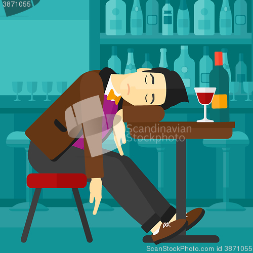 Image of Man sleeping in bar. 