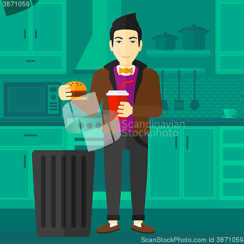 Image of Man throwing junk food.