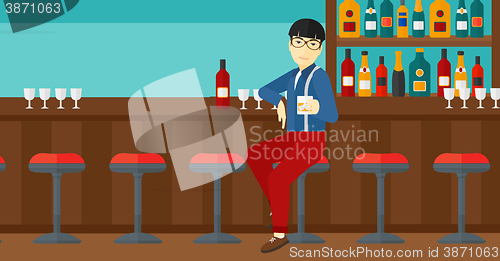 Image of Man sitting at bar.