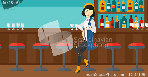 Image of Woman sitting at bar.