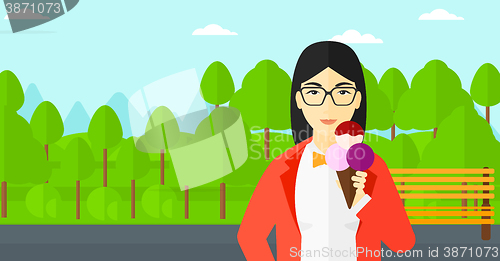 Image of Woman holding icecream.