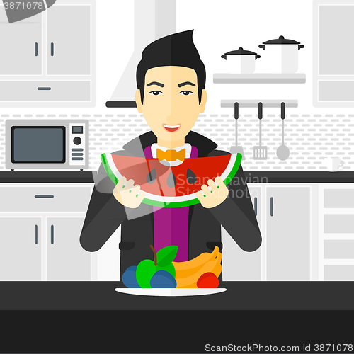 Image of Man eating watermelon.