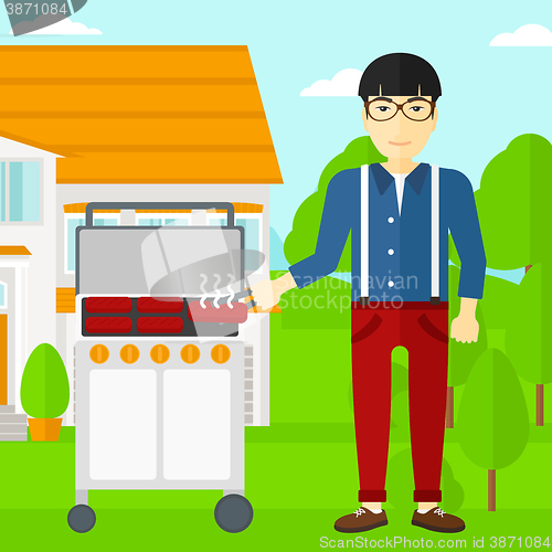Image of Man preparing barbecue.
