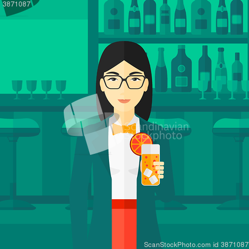 Image of Woman holding glass of juice.