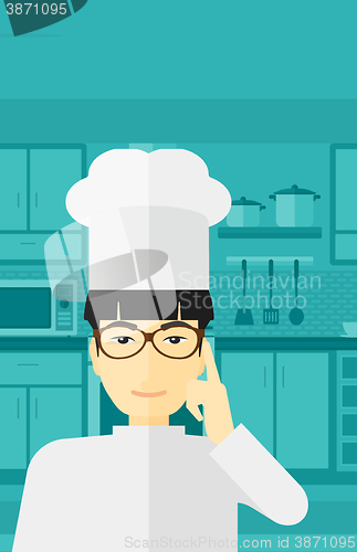 Image of Chef pointing forefinger up.