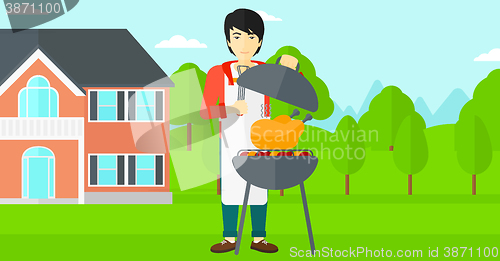 Image of Man preparing barbecue.