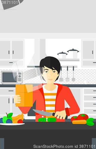 Image of Man cooking meal.