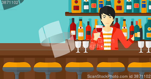 Image of Bartender standing at the bar counter.