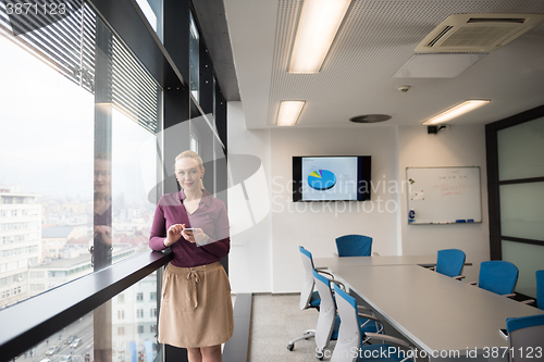 Image of young business woman using smart phone