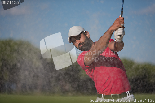 Image of golfer hitting a sand bunker shot