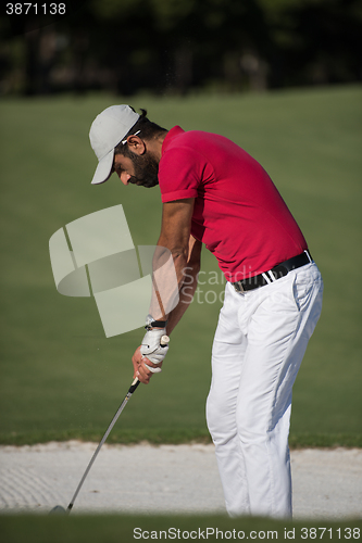 Image of golfer hitting a sand bunker shot