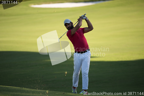 Image of golf player hitting long shot