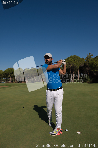 Image of golf player hitting shot