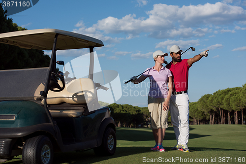 Image of portrait of golfers couple on golf course