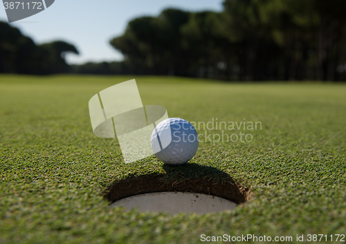 Image of golf ball in the hole