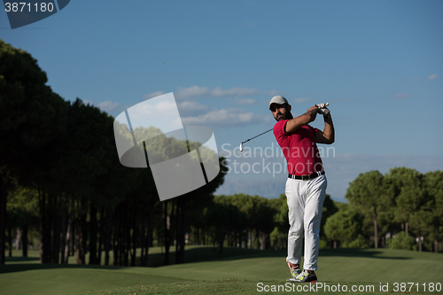 Image of golf player hitting long shot