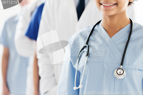 Image of close up of happy doctor or nurse with stethoscope