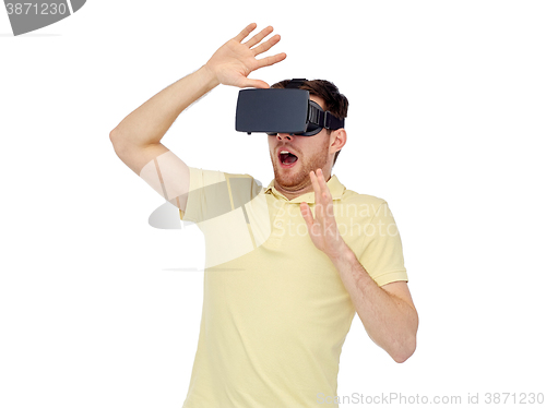 Image of happy man in virtual reality headset or 3d glasses