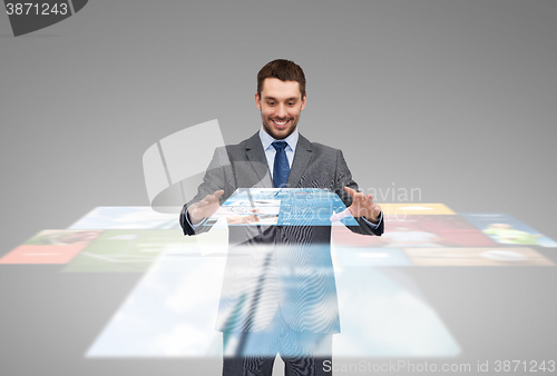 Image of businessman working with news projection