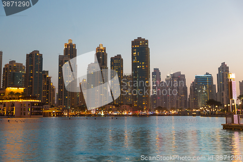 Image of Dubai city business district and seafront at night