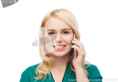 Image of happy young woman calling on smartphone