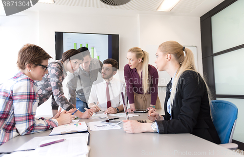 Image of young business people group on meeting at modern office