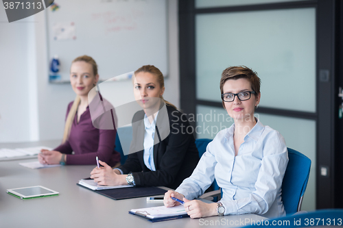 Image of young business people group on team meeting at modern office