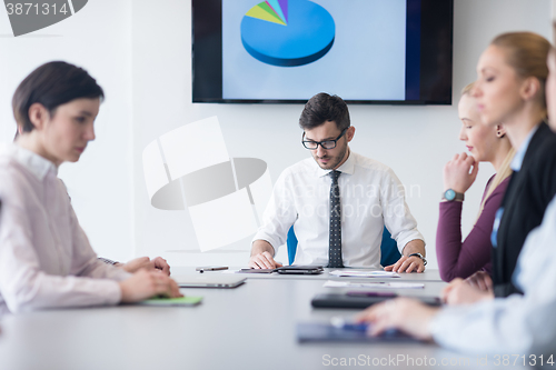 Image of young business people group on team meeting at modern office