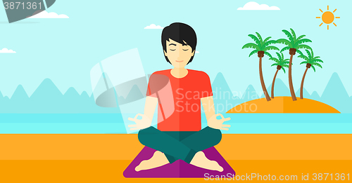 Image of Man meditating in lotus pose.