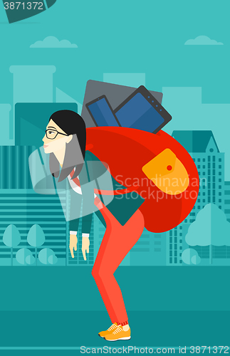Image of Woman with backpack full of devices.