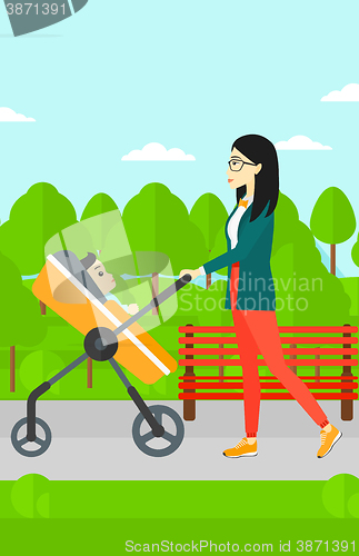 Image of Woman pushing pram.