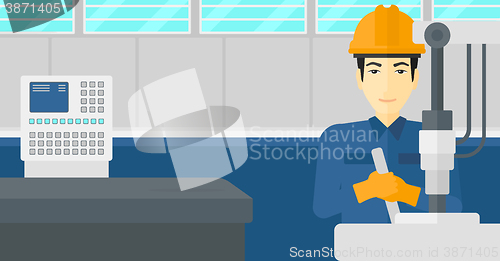 Image of Man working with industrial equipment.