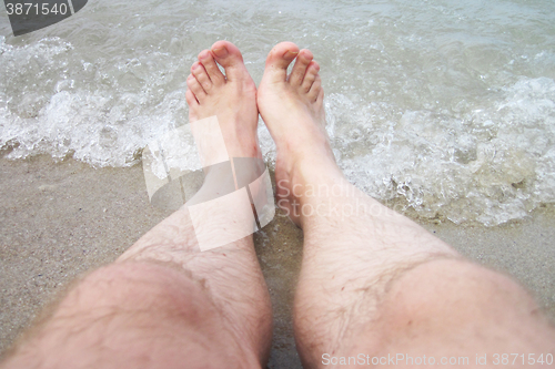 Image of man legs in the sea water