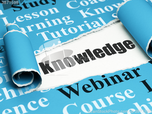 Image of Education concept: black text Knowledge under the piece of  torn paper