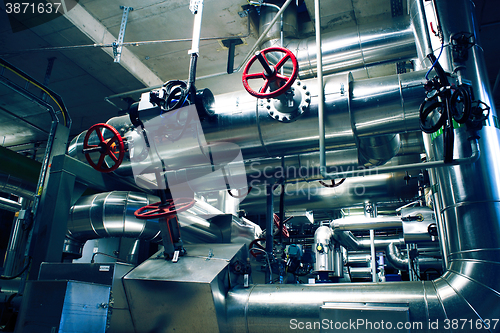 Image of Equipment, cables and piping as found inside of a modern industr