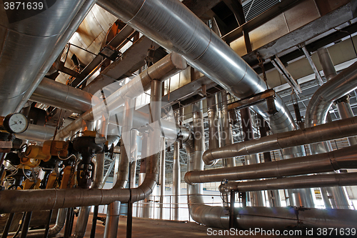 Image of Equipment, cables and piping as found inside of a modern industr