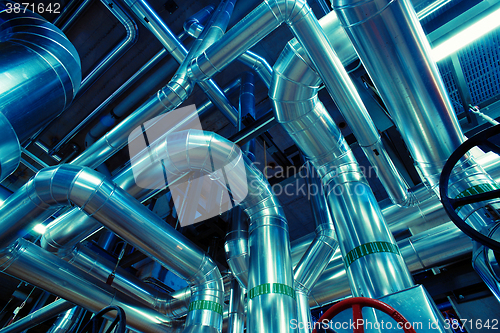 Image of Equipment, cables and piping as found inside of a modern industr