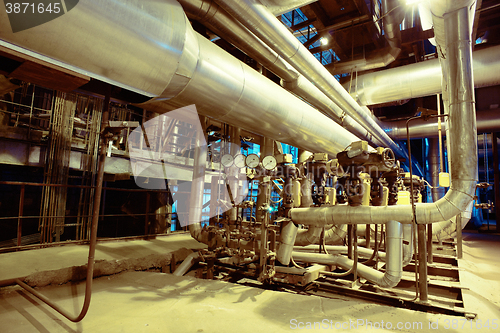 Image of Equipment, cables and piping as found inside of a modern industr